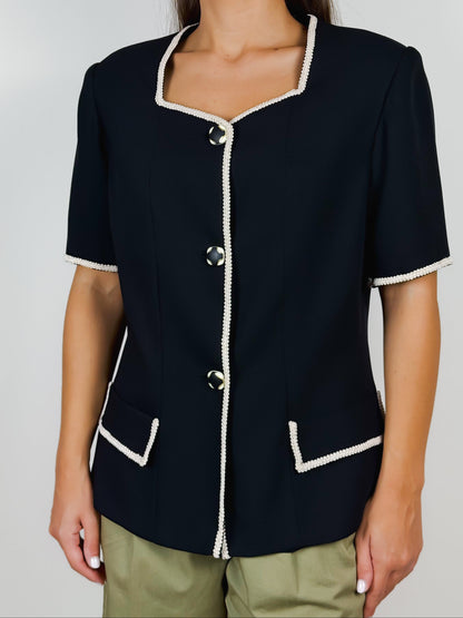 Giacca vintage sartoriale nera con bordi bianchi e spalline imbottite – anni ’80